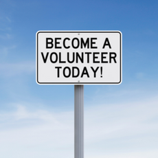 A sign that says Become a Volunteer Today