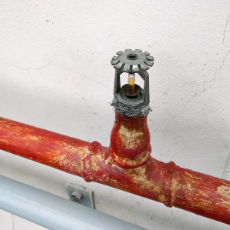 fire sprinkler for a building with red pipes
