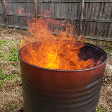 metal barrel with a fire inside